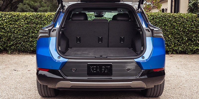 2026 Chevrolet Equinox EV rear cargo area showing spacious trunk and foldable seats in Northampton, MA