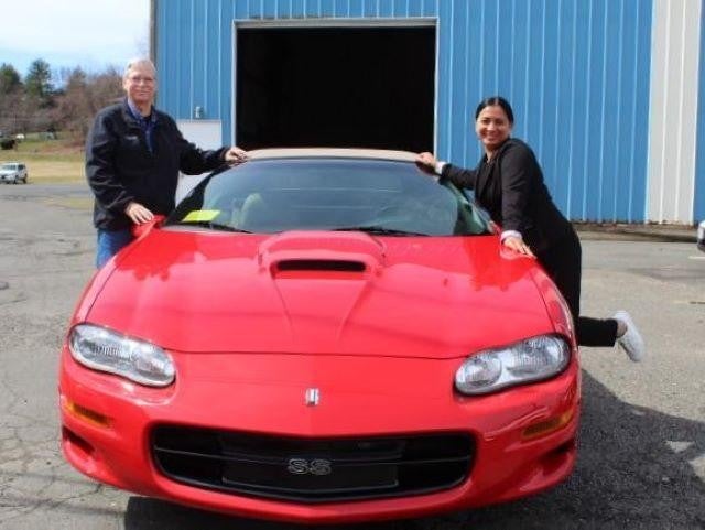 A_Happy_couple_with_red_car